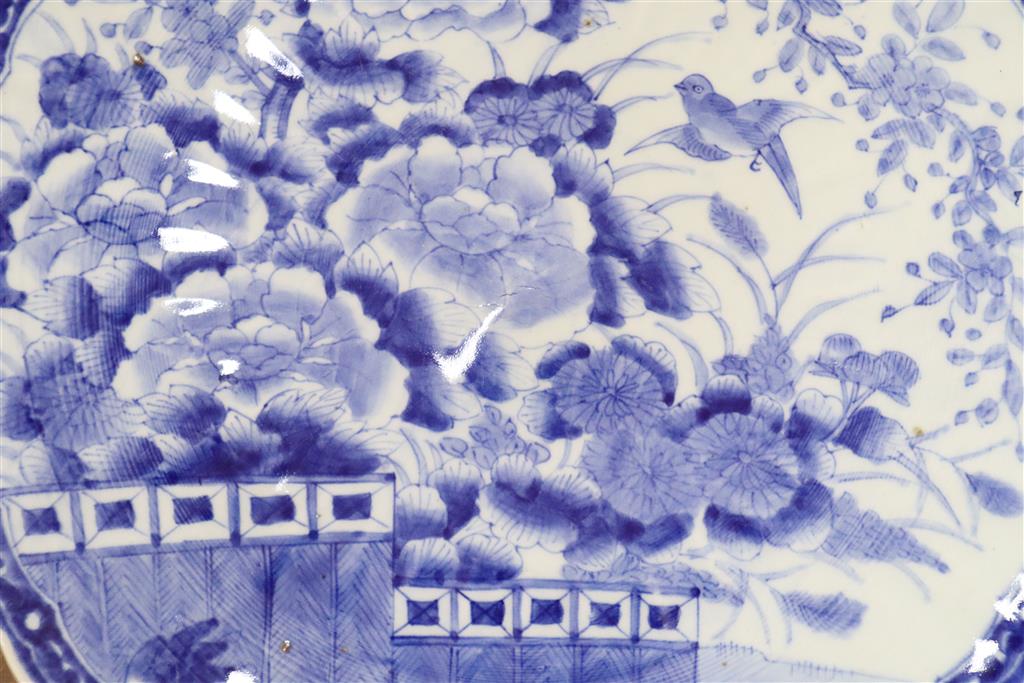 A Japanese blue and white charger decorated with a flying bird and chrysanthemum flowers, 48cm diameter Dia 47.5cm